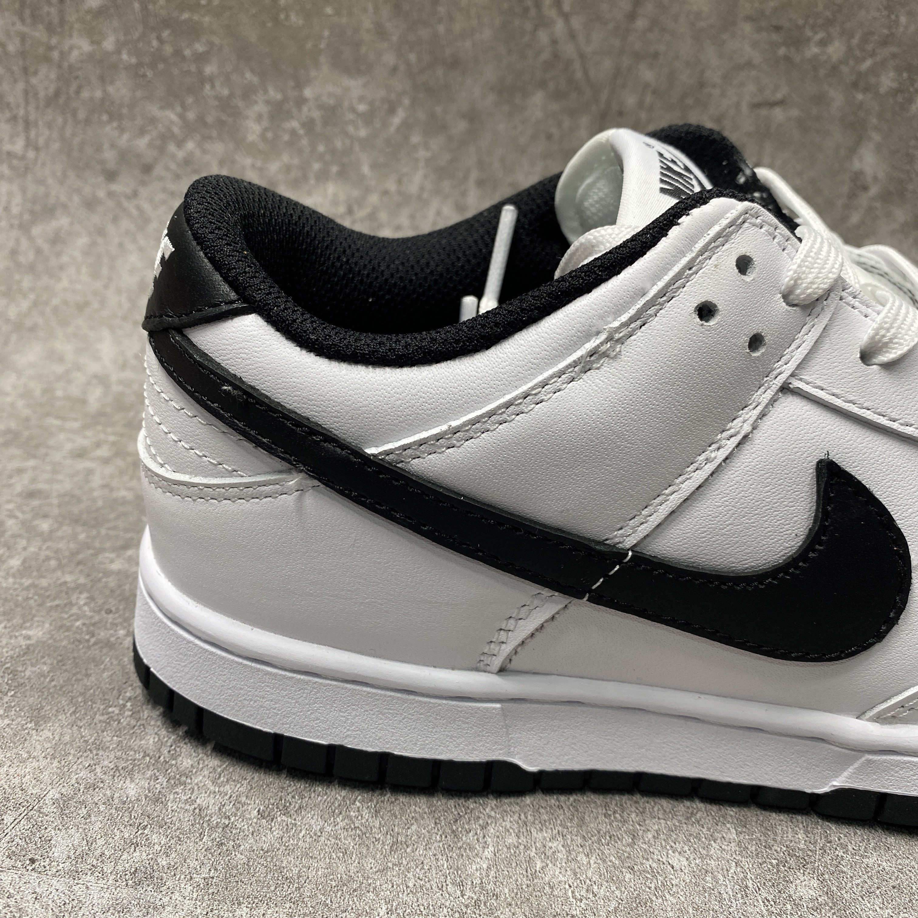 nike dunk low surF**es in clean white and black